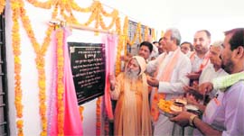 Prahlad Singh Gillankhera, chief parliamentary secretary, and Swami Divyanand inaugurate a computer centre in Fatehabad.
