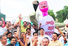 Supporters of Health Minister Lakshmi Kanta Chawla raise slogans against BJP leader Jagdish Sahni in Amritsar on Thursday. 