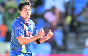 India�s Vinay Kumar celebrates after taking the wicket of Sri Lanka�s Sanath Jayasuriya at the Beausejour Cricket Ground on Tuesday.