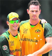 Australian captain Michael Clarke (L) will be relying heavily on his pace attack, including Shaun Tait (R).