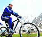 French forward Thierry Henry cycles during a training 