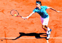 Roger Federer plays a return to Peter Luczak during their first round match on Monday. Federer won 6-4, 6-1, 6-2