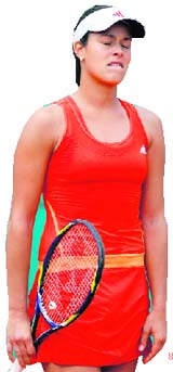 Ana Ivanovic reacts during her match against Alisa Kleybanova in Paris on Thursday.