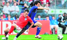 John Terry (L) and Shinji Okazaki fight for the ball in Graz on Sunday.