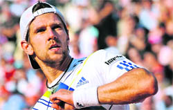 Jurgen Melzer celebrates after beating Novak Djokovic on Wednesday.