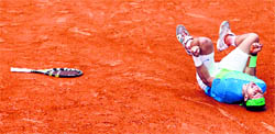 Rafael Nadal reacts after he beating Robin Soderling in Paris on Sunday