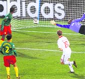 Dennis Rommedahl (R) scores the winner on Saturday.