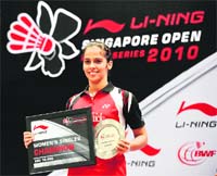 Saina Nehwal poses with her trophy after winning the 2010 Singapore Open on Sunday. 