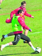 Swiss forward Alexander Frei is marked by midfielder Tranquillo Barnetta during a training session on Sunday.