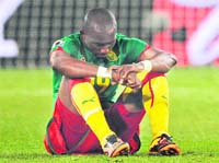 Cameroon's Stephane Mbia reacts after his team's loss. 