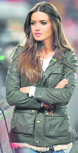 Sara Carbonero, Spanish TV reporter and girlfriend of Spain�s goalkeeper Iker Casillas, waits for the start of the match between Spain and Honduras in Johannesburg