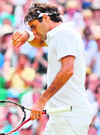Roger Federer reacts to losing a point on Wednesday