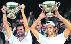 Jurgen Melzer (R) and Philipp Petzschner with their trophies after beating Robert Lindstedt and Horia Tecau 6-1, 7-5, 7-5, in the Men's Doubles Final.