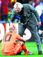 Dutch coach Bert van Marwijk consoles Wesley Sneijder after they lost the World Cup final to Spain in Johannesburg on Sunday. 