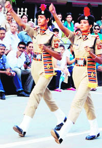 Women constables of the BSF take part in the Retreat ceremony at the Attari-Wagah joint checkpost on Wednesday.