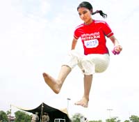 A candidate performs the long jump during the physical fitness test in Bathinda on Monday