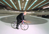 Mayor of London Boris Johnson cycles around a temporary track in the Velodrome arena of the London 2012 Olympic site in Stratford, east London
