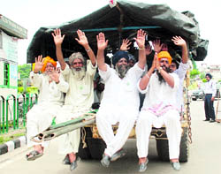 Farmers in a jubilant mood after they called off their strike, in Mohali on Friday
