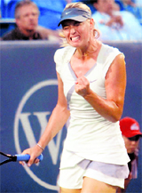 Maria Sharapova (Russia) reacts after breaking Marion Bartoli (France) during a match at the Cincinnati Open tennis tournament on Friday.