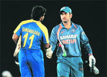 Sri Lanka captain Kumar Sangakkara shakes hands with MS Dhoni after the match on Sunday.