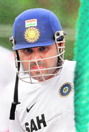 Virender Sehwag watches other teammates during a practice session in Dambulla