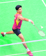 Chetan Anand hits a return to Ong Zhao Ashton Shen during at the Pierre de Coubertin stadium in Paris.