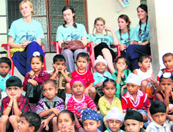 Students of Oxford University with schoolchildren in Dhulka village in Amritsar district 
