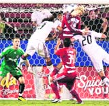 Dallas forward Brek Shea (C) heads the ball against Toronto defenders Maxim Usanov (2nd L) and Ty Harden (R) as goalkeeper Stefan Frei (L) and forward Ruben Luna (34) watch in the second half of their MLS soccer match in Frisco, Texas,