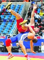 Mohammed Ibrahim Abdelfatah of Egypt throws Soso Jabidze of Georgia during 96-kg Greco-Roman match at the World Wrestling Championships in Moscow on Monday.