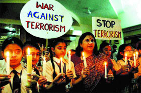 Students and Principal of DAV Public School Neera Sharma take out a candlelight march on the eve of terrorist attack on the World Trade Center in Amritsar on Friday.