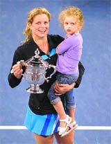 Kim Clijsters from Belgium with her daughter Jada after defeating Russia�s Vera Zvonareva in the women's singles final at US Open in New York on Saturday. 