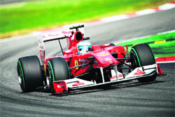 Ferrari's Fernando Alonso drives at the Autodromo Nazionale circuit in Monza on Sunday. Alonso won the race ahead of McLaren Mercedes' Jenson Button and Ferrari's Felipe Massa.