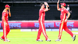 Royal Challengers Bangalore�s Dale Steyn (C) is congratulated by teammate for the dismissal of Mumbai Indians batsman Shikhar Dhawan (not pictured) during the Champions League Twenty20 League match in Durban, on Sunday