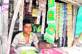 A minor boy sells tobacco products in violation of the Anti-Tobacco Act, in Ludhiana on Sunday.