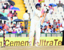 Sachin Tendulkar plays a backfoot defensive shot against Australia at the PCA stadium in Mohali on Monday. India need 161 runs to win with six wickets in hand on the last day of the Test.