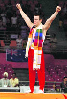 England�s gold medallist Luke Folwell celebrates after winning the artistic men�s individual all-around final.