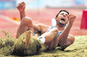 India's Bharat Inder Singh in action during the long jump event of Commonwealth Games at Jawaharlal Nehru Stadium in New Delhi on Thursday