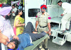 A striking teacher being taken to a hospital in Mohali on Monday.