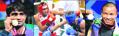 (L-R) Paramjeet Samota kisses his gold medal after winning the super heavy weight bout. Manoj Kumar lands a left punch on Bradely Saunders of England during light welter (60-64 kg) bout. Manoj won by 11-2. M Suranjoy shows his gold medal he won in the fly weight 49-52 kg category. His opponent failed to turn up due to injury.