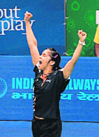 Saina Nehwal exults after winning singles gold. 