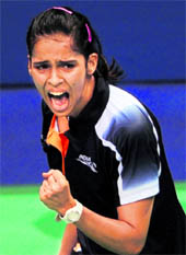 Gold medalist Saina Nehwal reacts after defeating Wong Mew Choo of Malaysia in the women's singles badminton final at the Siri Fort Sports Complex in New Delhi