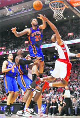 Toronto Raptors� Jarrett Jack goes to the basket against New York Knicks' Wilson Chandler (21) during the second half of their NBA basketball game in Toronto