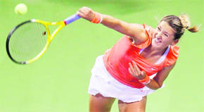 Victoria Azarenka of Belarus serves during the WTA Tour Championships in Doha on Saturday. � Reuters