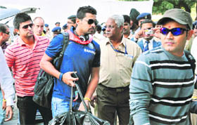 Virender Sehwag (R) Murli Vijay (C) and Suresh Raina (L) arrive for the first Test against New Zealand, while New Zealand skipper Daniel Vettori trains at Sardar Patel Stadium Motera in Ahmedabad on Monday.