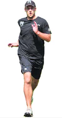 New Zealand captain Daniel Vettori runs during a practice session in Ahmedabad on Wednesday