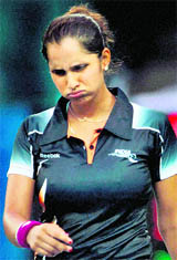 Sania Mirza reacts after losing a point to Akgui Amanmuradova of Uzbekistan during their women's singles semi-final at the Aoti tennis centre in Guangzhou on Sunday.