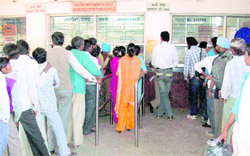 Passengers queue up outside the ticket window at Rajpura Railway Station