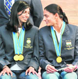 Asian Games Gold medal winners Ashwini Akkunji (L) and Manjeet Kaur at the Rashtrapati Bhavan in New Delhi on Saturday.
