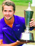 Sweden�s Rikard Karlberg with the trophy after winning the Hero Honda Indian Open in New Delhi on Sunday