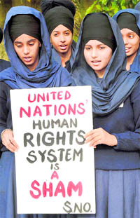 Students from Gursikh Phulwari Public School hold a protest in Patiala on International Human Rights Day against �inaction� on the turban issue in France, on Friday